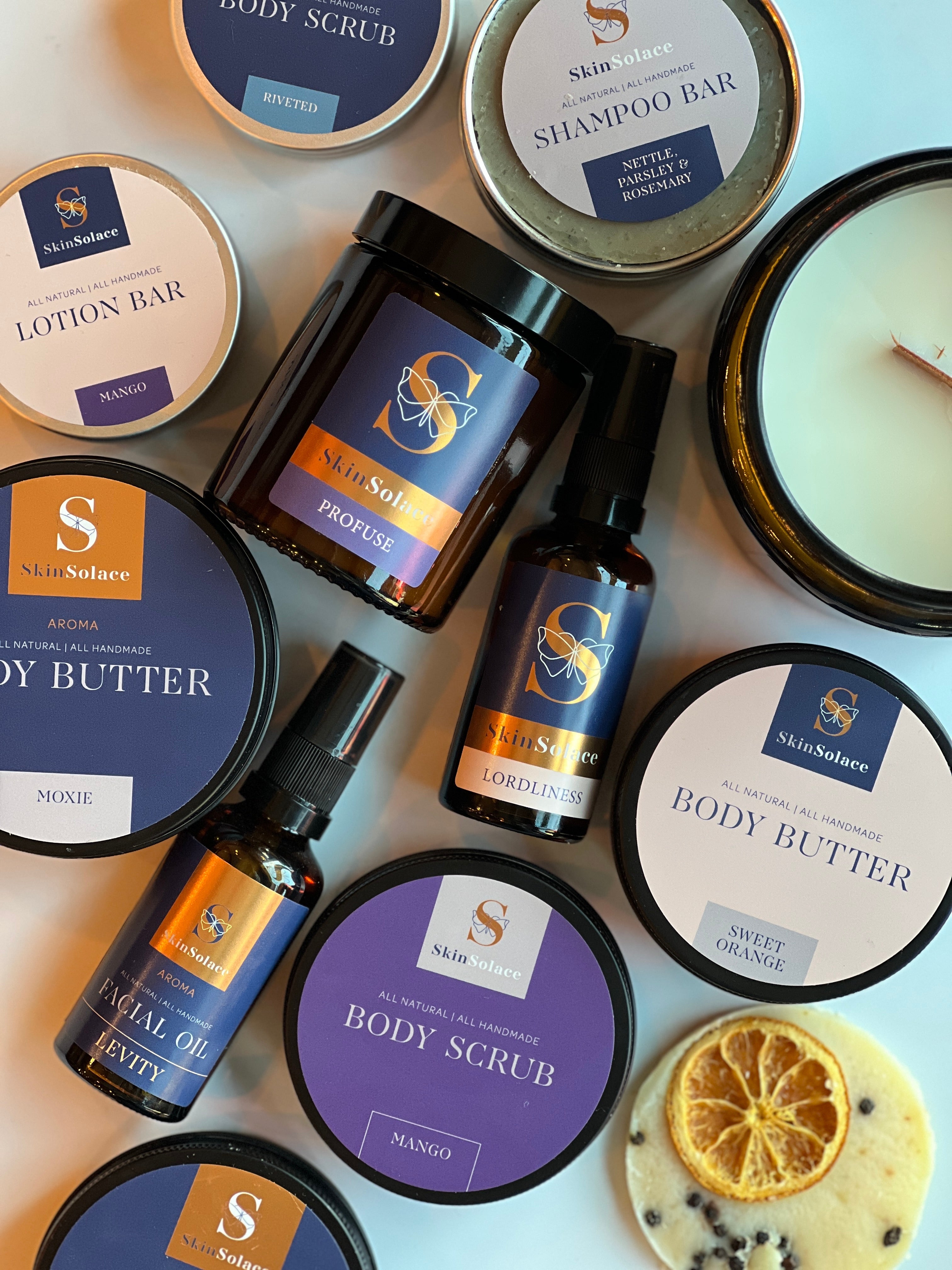 Flatley of skincare products, candles, body butters, shampoo bars and body scrubs