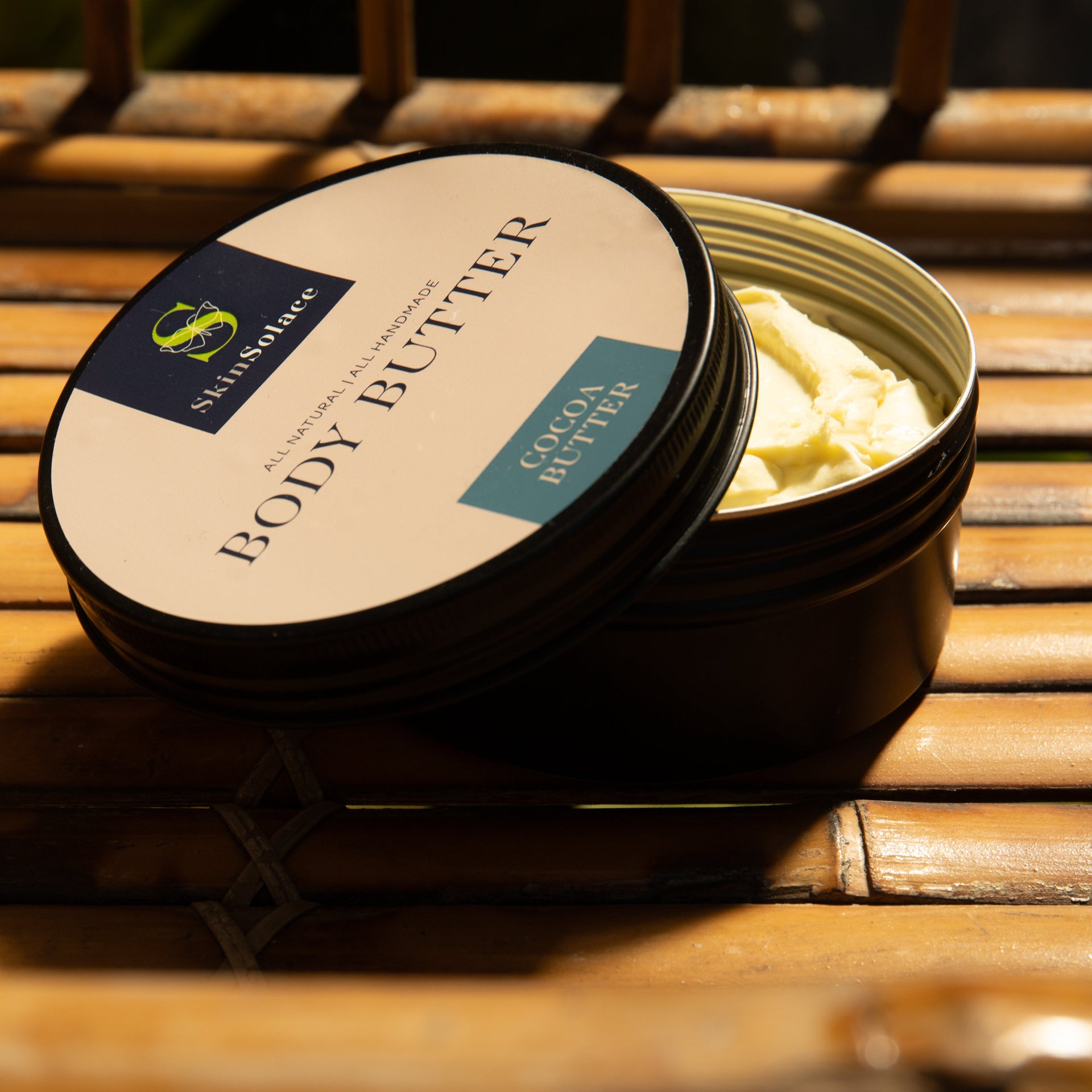 Body butter container on a wooden surface