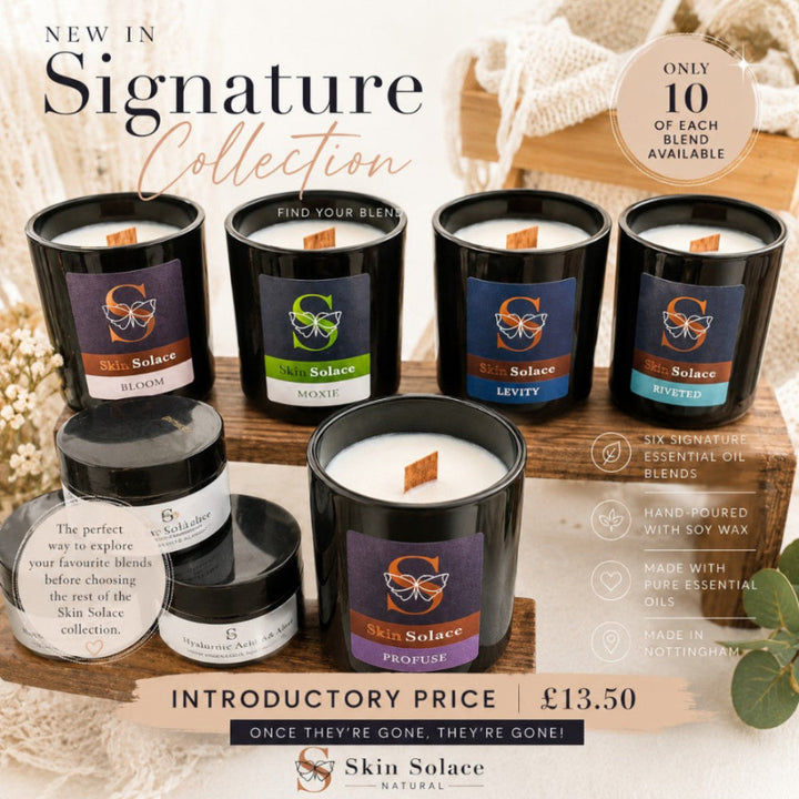 Six Skin Solace scented candles in black glass jars arranged on a wooden crate with promotional text overlays for the 'New in Signature Collection'.